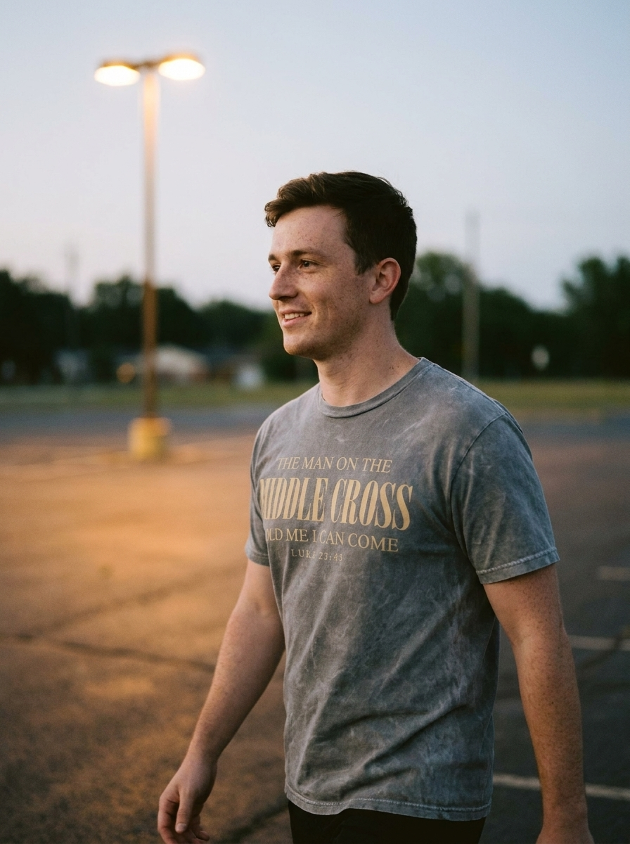The Man On The Middle Cross shirt, gold serif print on mineral washed gray
