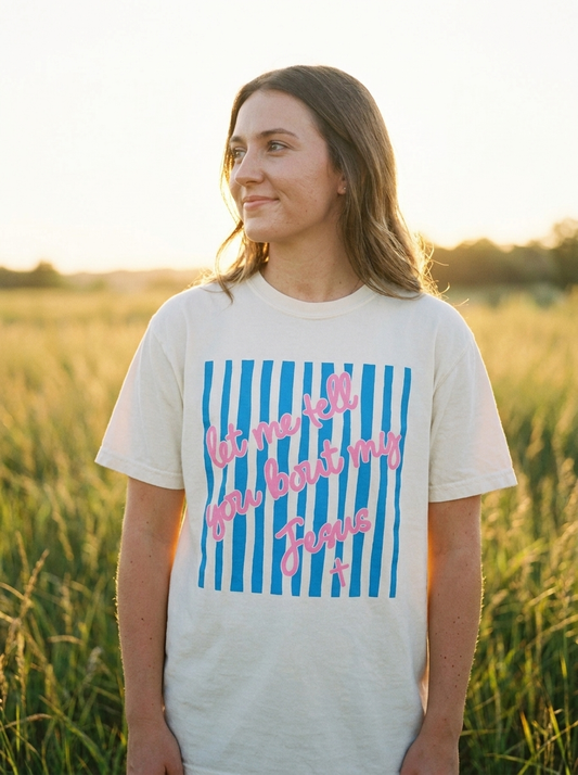 Let Me Tell You Bout My Jesus shirt worn, pink script over blue stripes on ivory