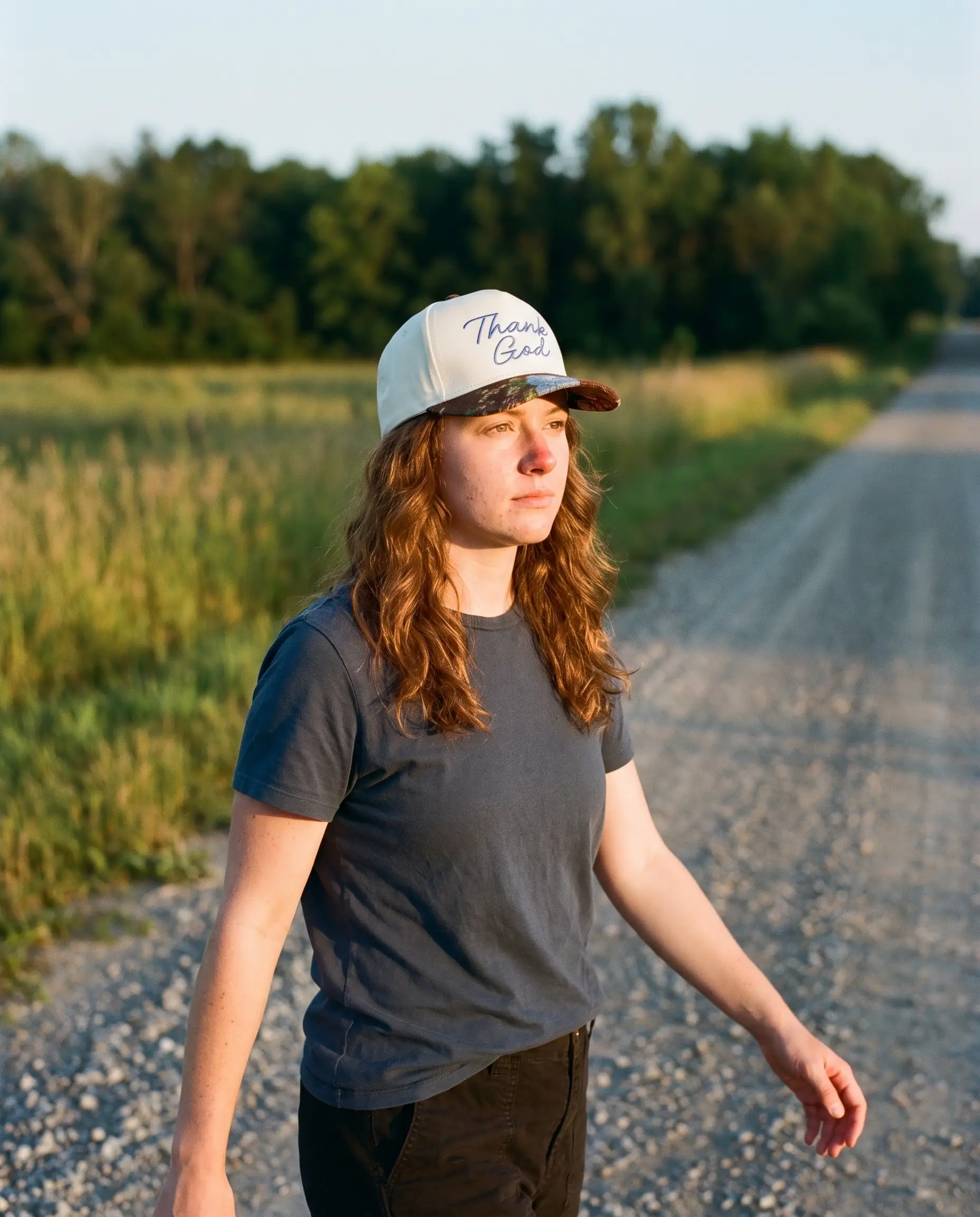 Model wearing the Thank God Script Hat, Floral Brim, second view