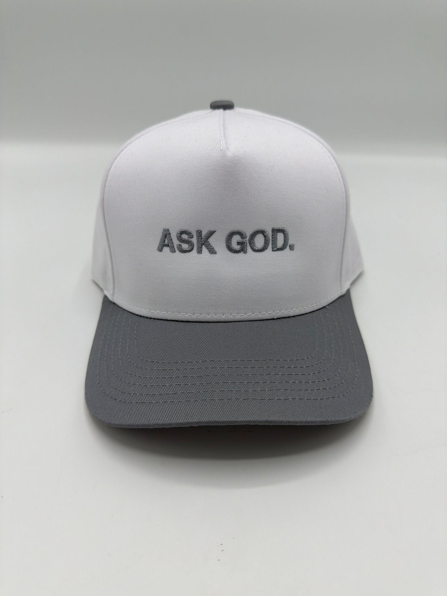Ask God in grey puff embroidery on a white crown with a grey brim