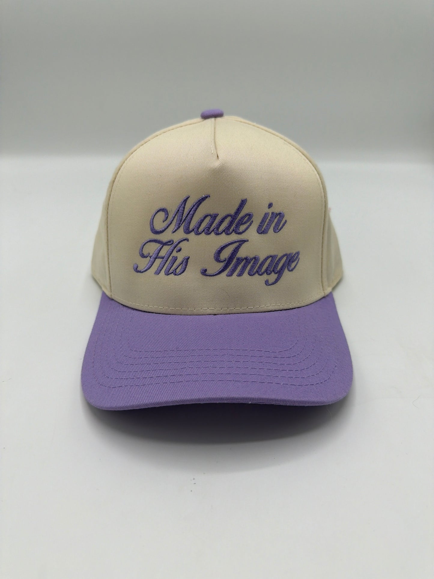 Made In His Image in light purple script on a cream crown with a lilac brim