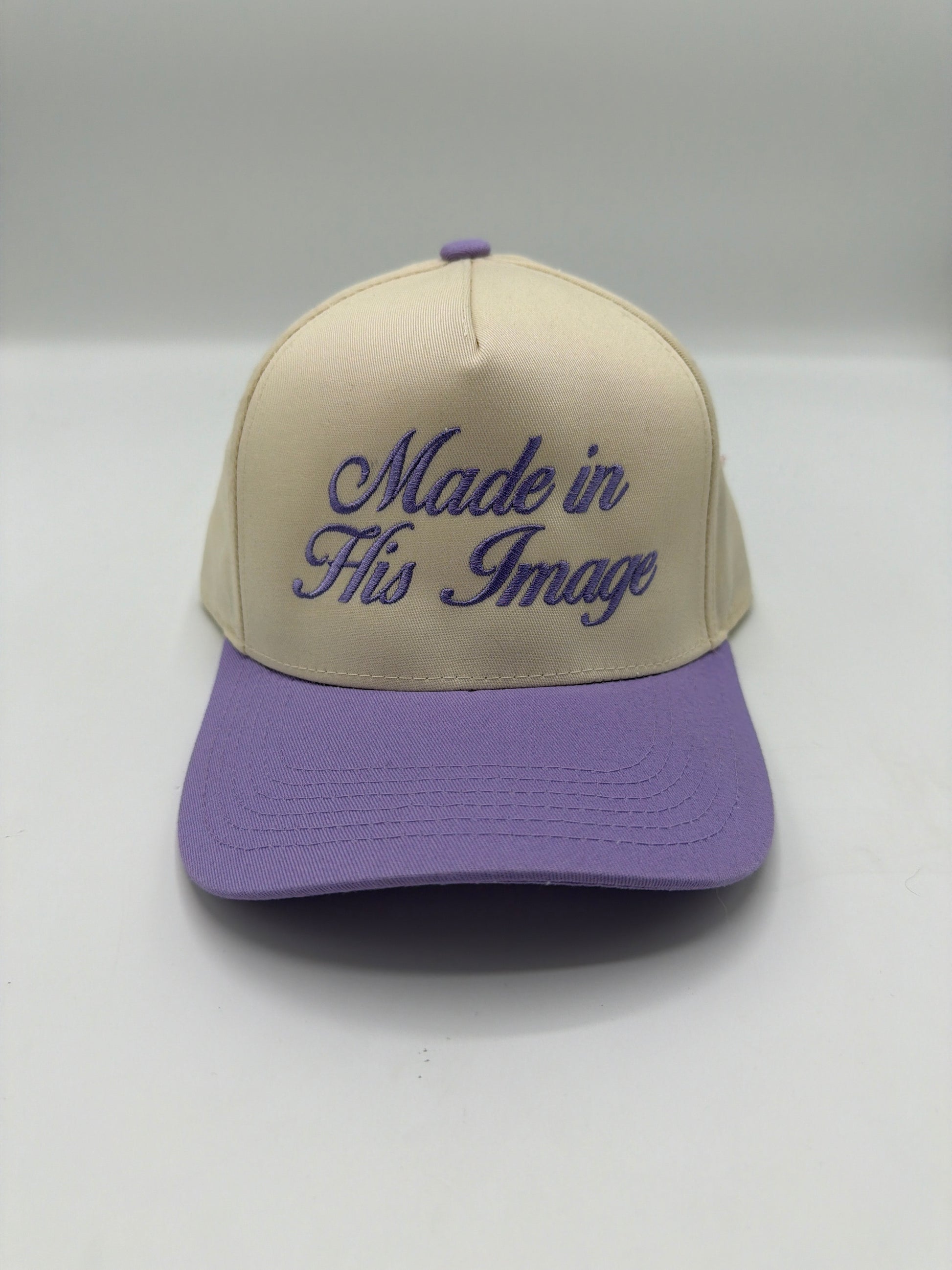 Made In His Image in light purple script on a cream crown with a lilac brim