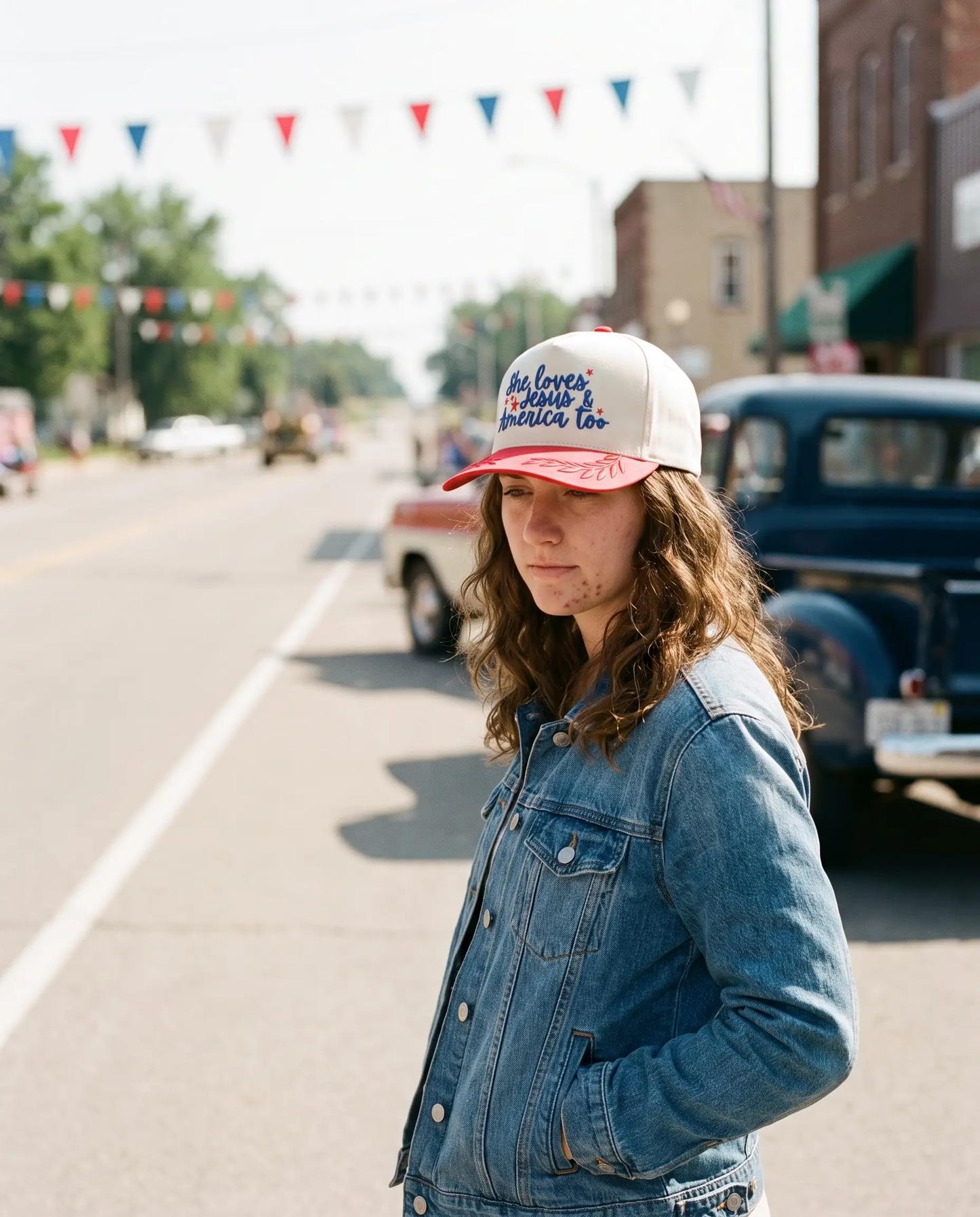 Model wearing the She Loves Jesus and America Too Hat, Red, second view