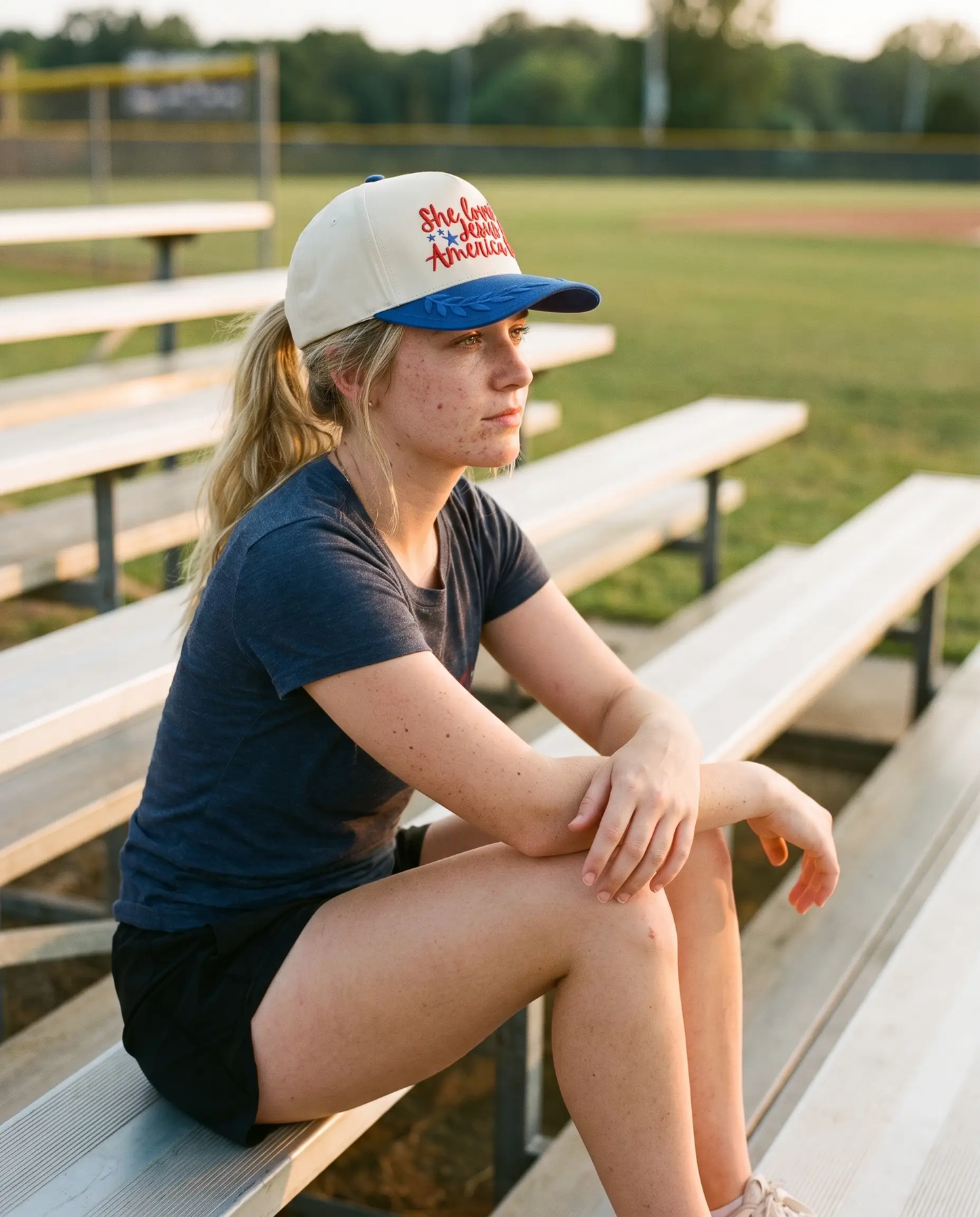 Model wearing the She Loves Jesus and America Too Hat, Royal Blue, second view