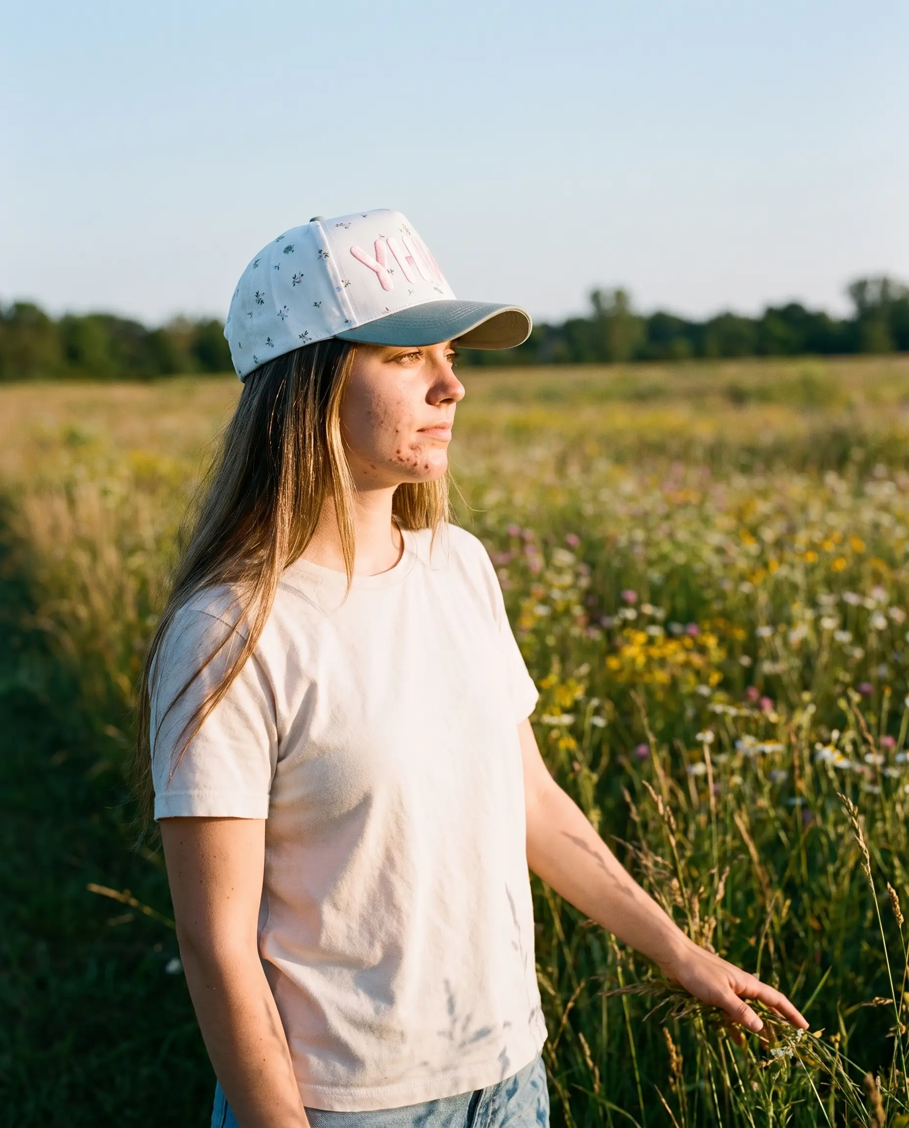 Model wearing the YHWH Hat, Floral, second view