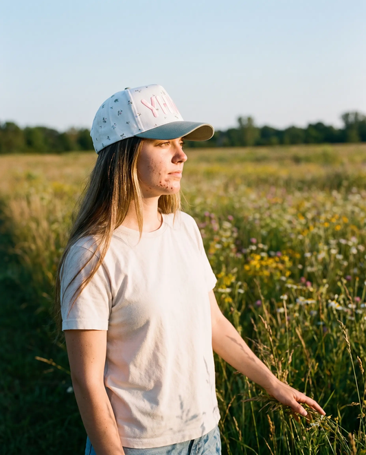 Model wearing the YHWH Hat, Floral, second view