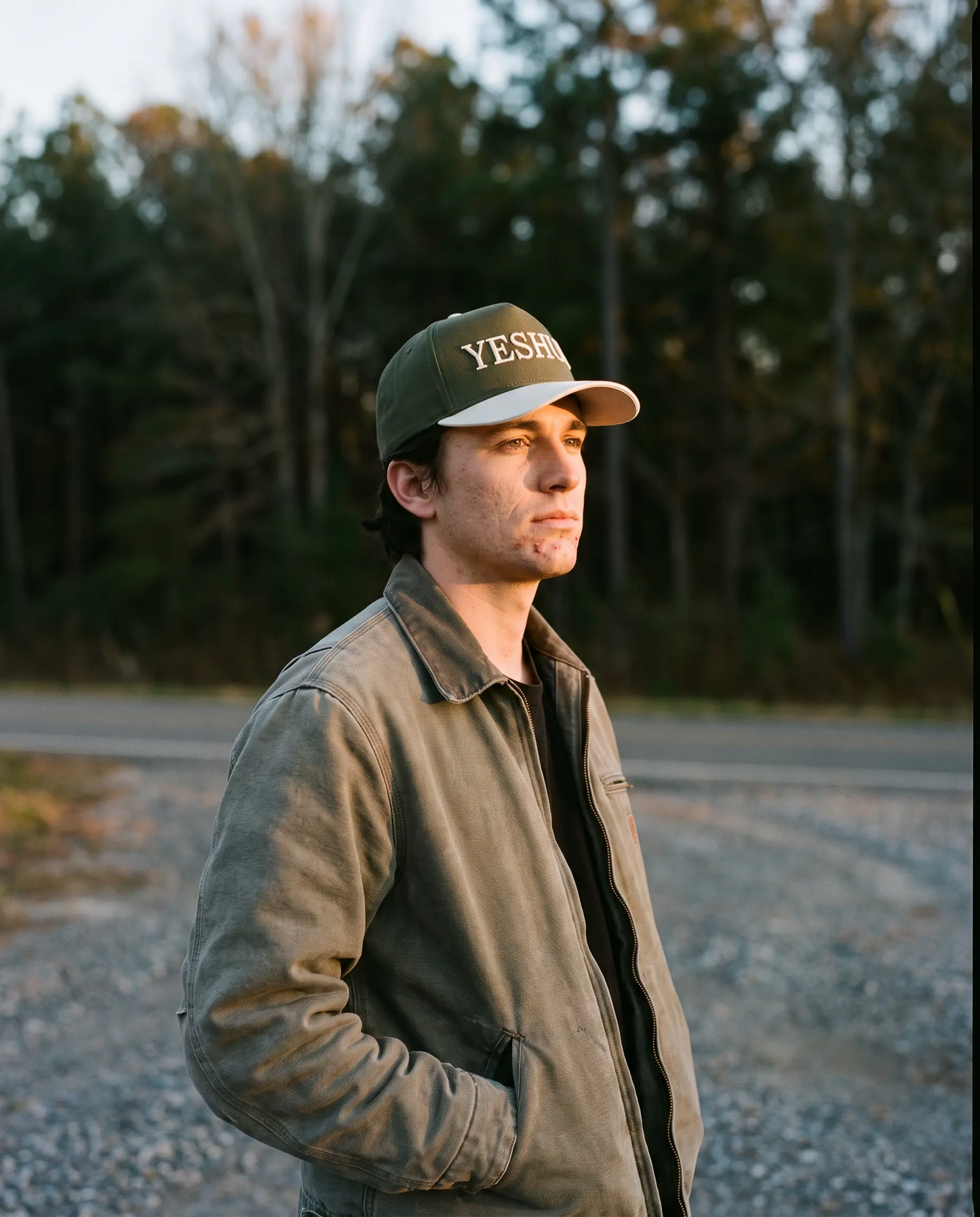 Model wearing the Yeshua Hat, Olive, second view