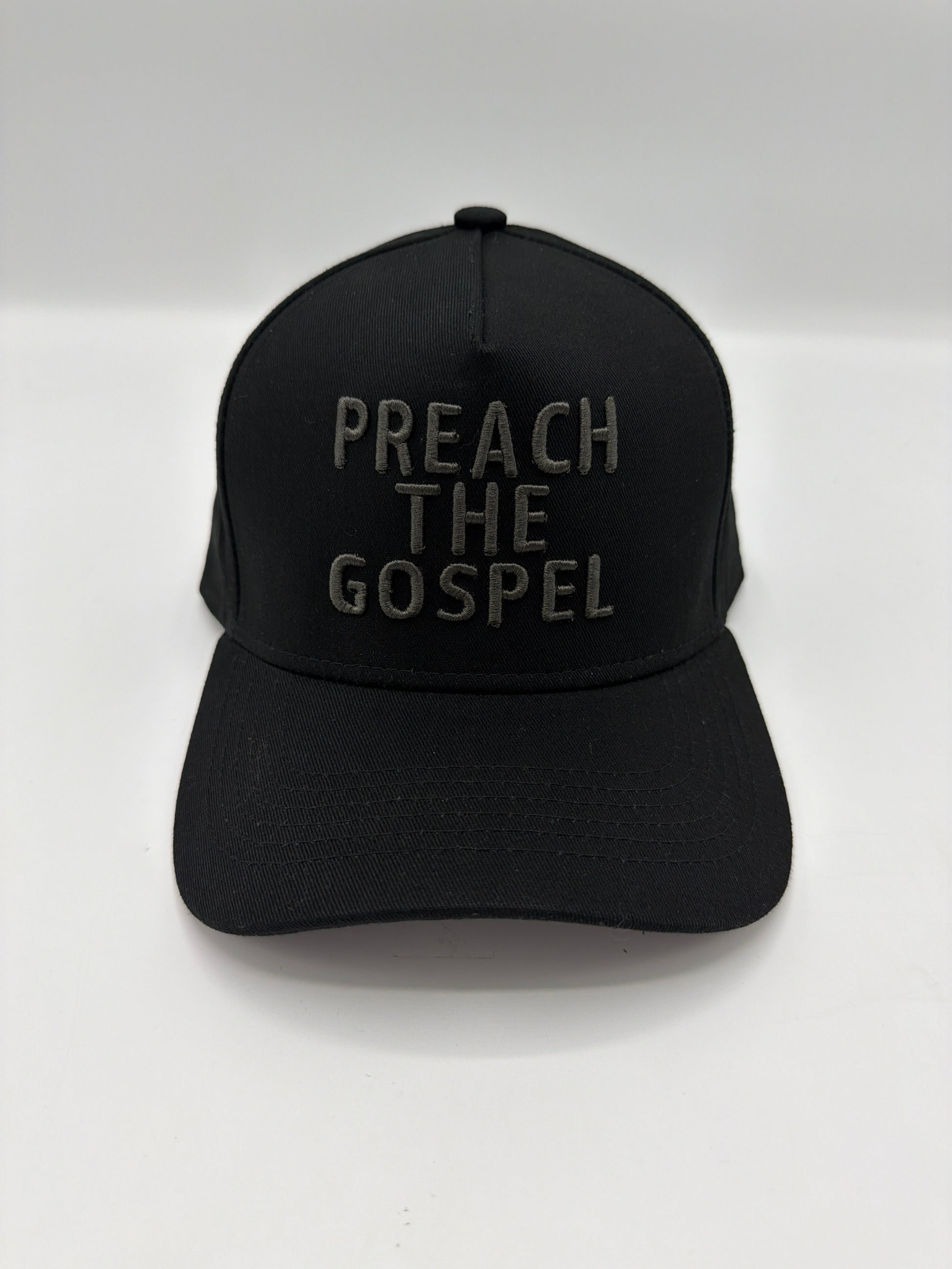 Preach The Gospel in tonal charcoal puff embroidery on an all black five panel snapback