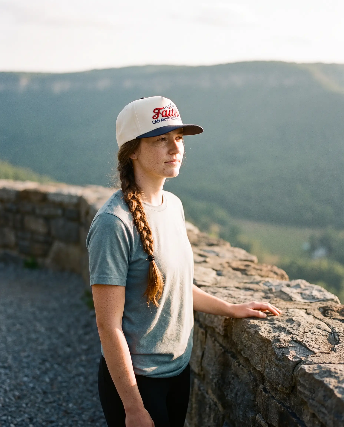 Model wearing the Faith Can Move Mountains Hat, Navy, second view