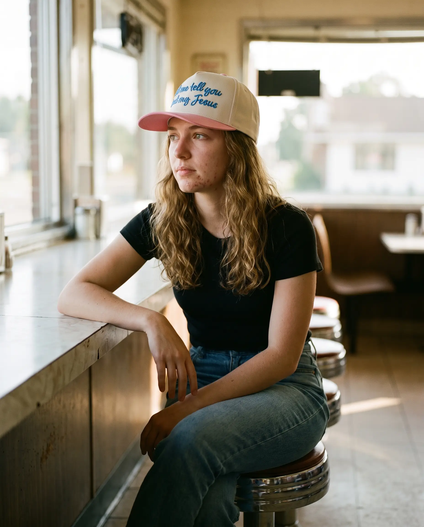 Model wearing the Let Me Tell You Bout My Jesus Hat, Pink, second view