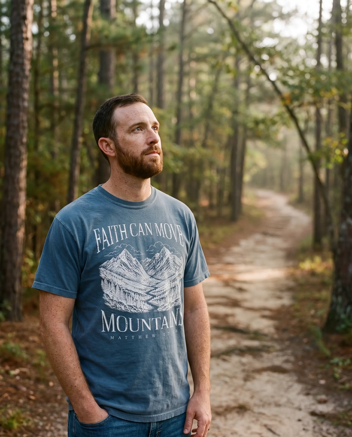 Model wearing the Faith Can Move Mountains Shirt, Denim
