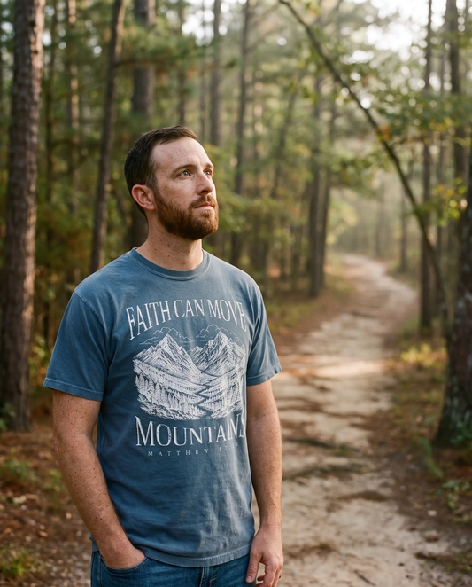Model wearing the Faith Can Move Mountains Shirt, Denim