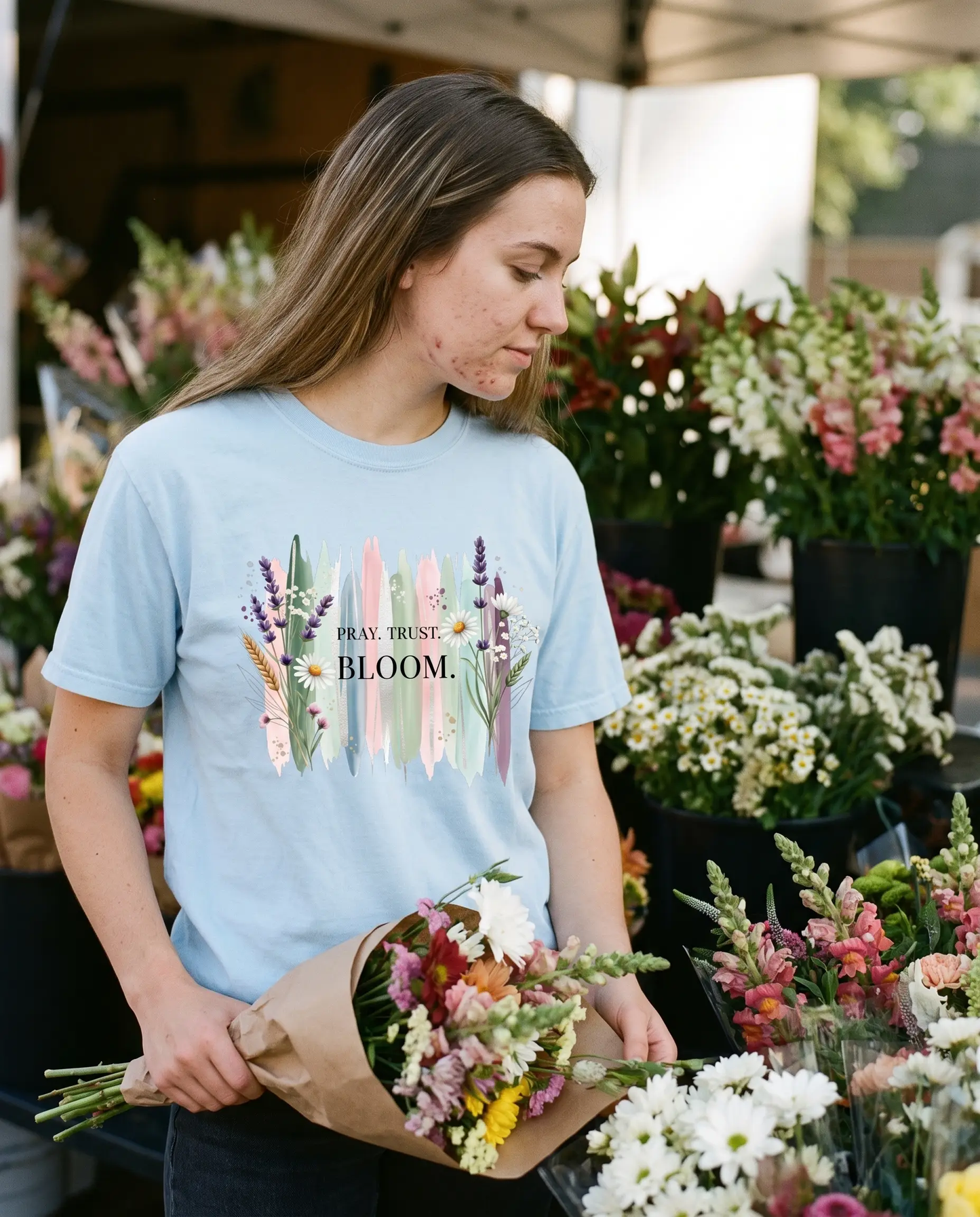 Model wearing the Pray Trust Bloom Shirt