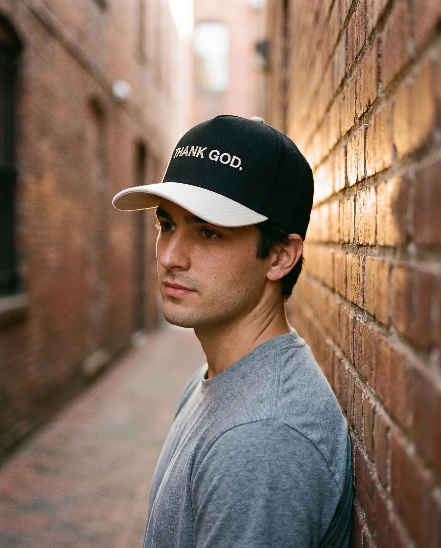 Model wearing the Thank God Hat, Black and Cream
