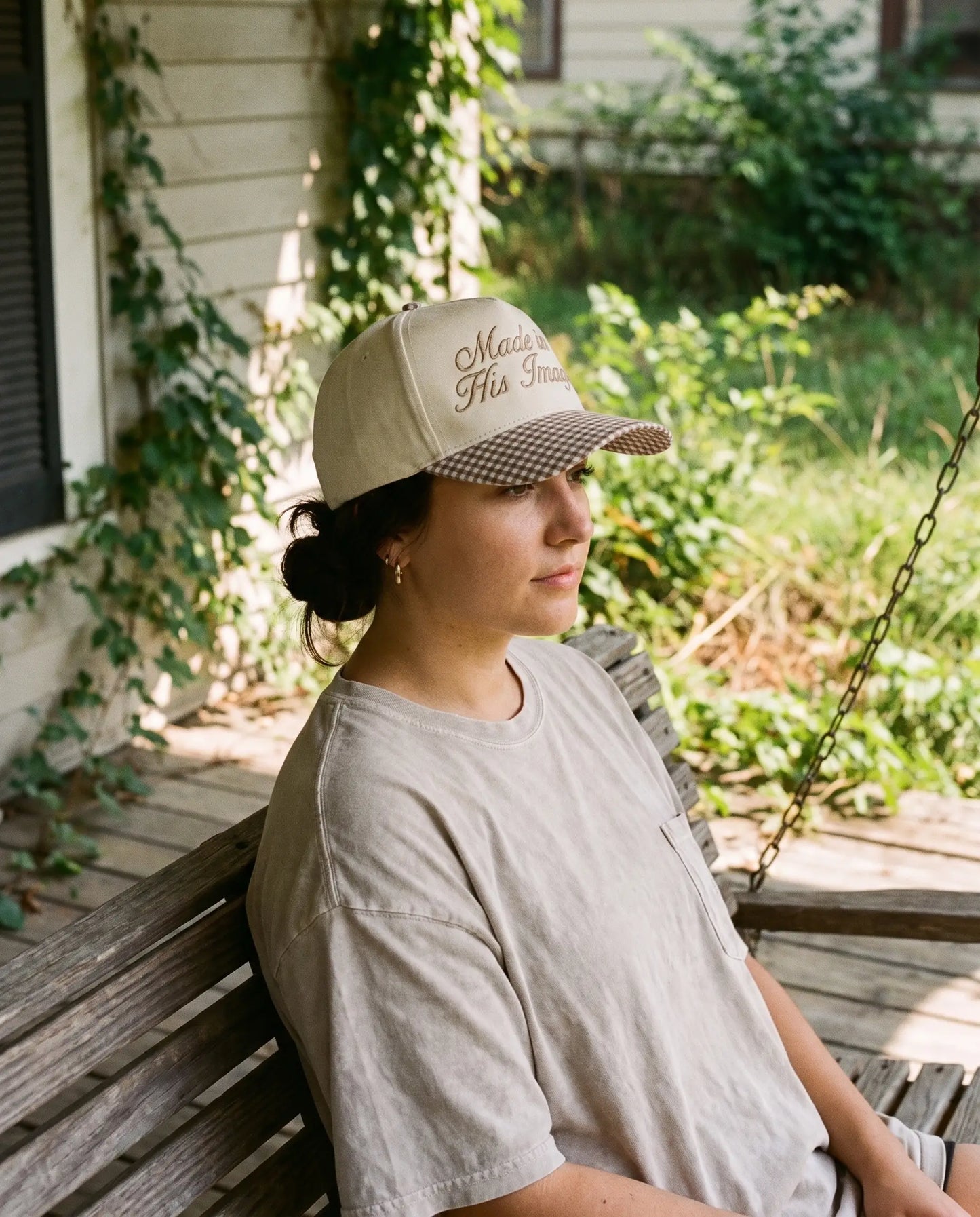 Model wearing the Made In His Image Hat, Brown Gingham