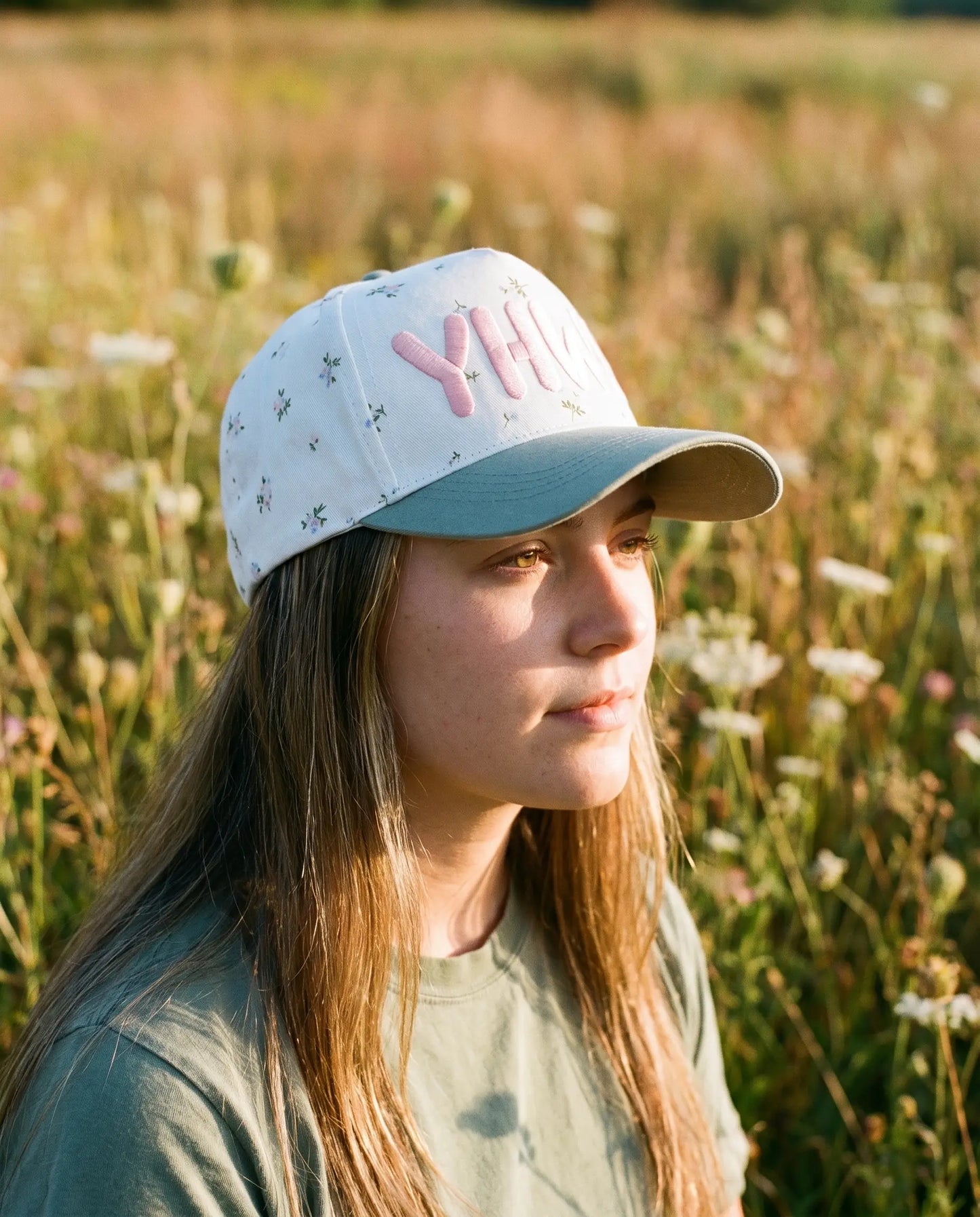 Model wearing the YHWH Hat, Floral