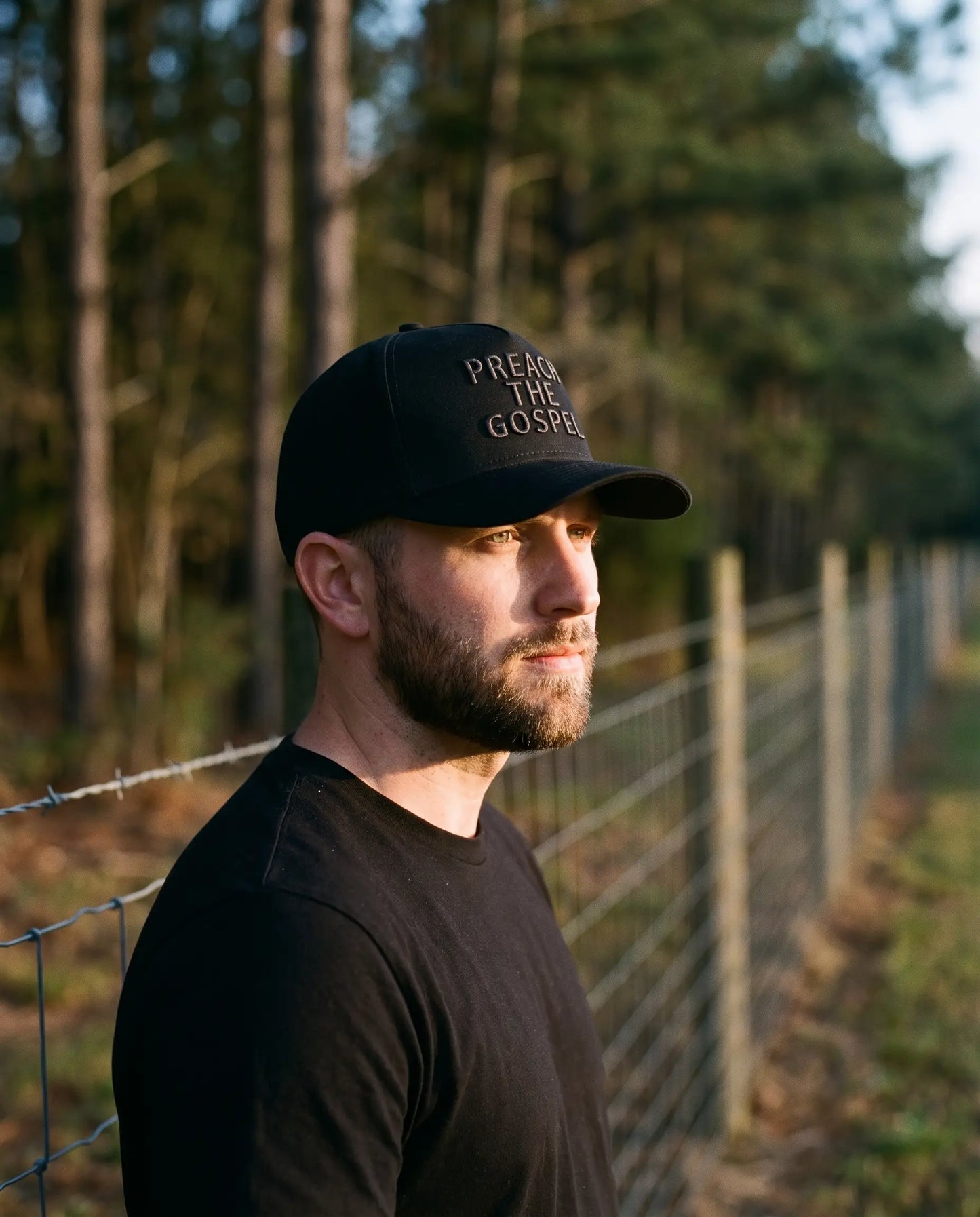 Model wearing the Preach The Gospel Hat, Blackout