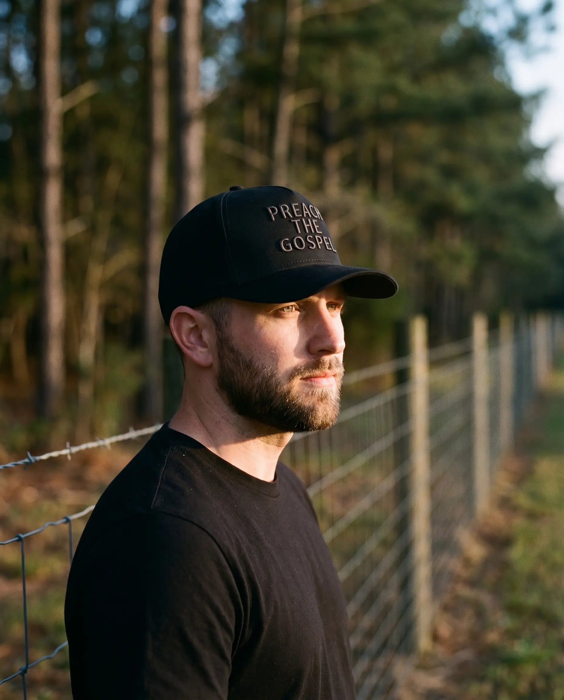 Model wearing the Preach The Gospel Hat, Blackout