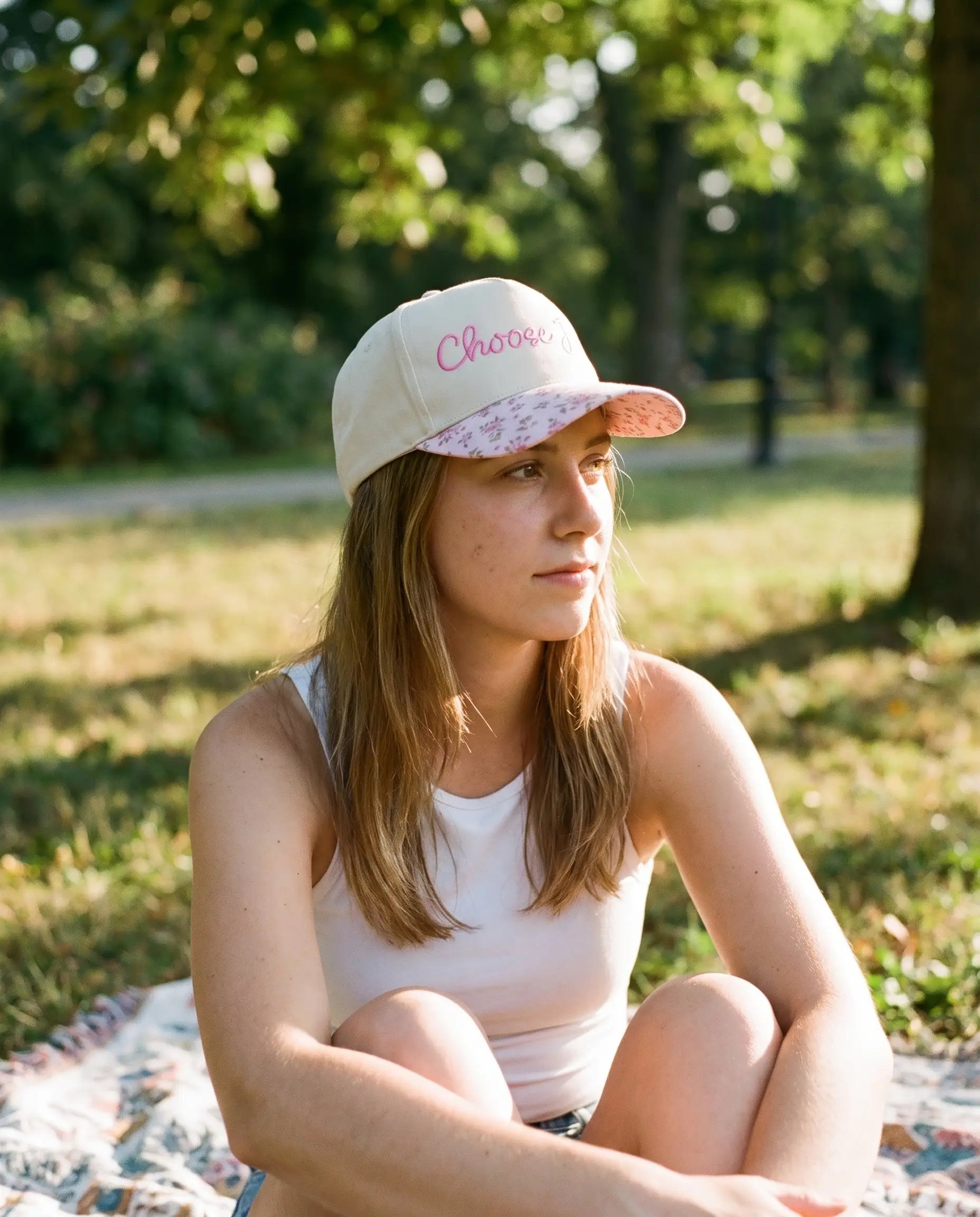 Model wearing the Choose Joy Hat, Floral Brim