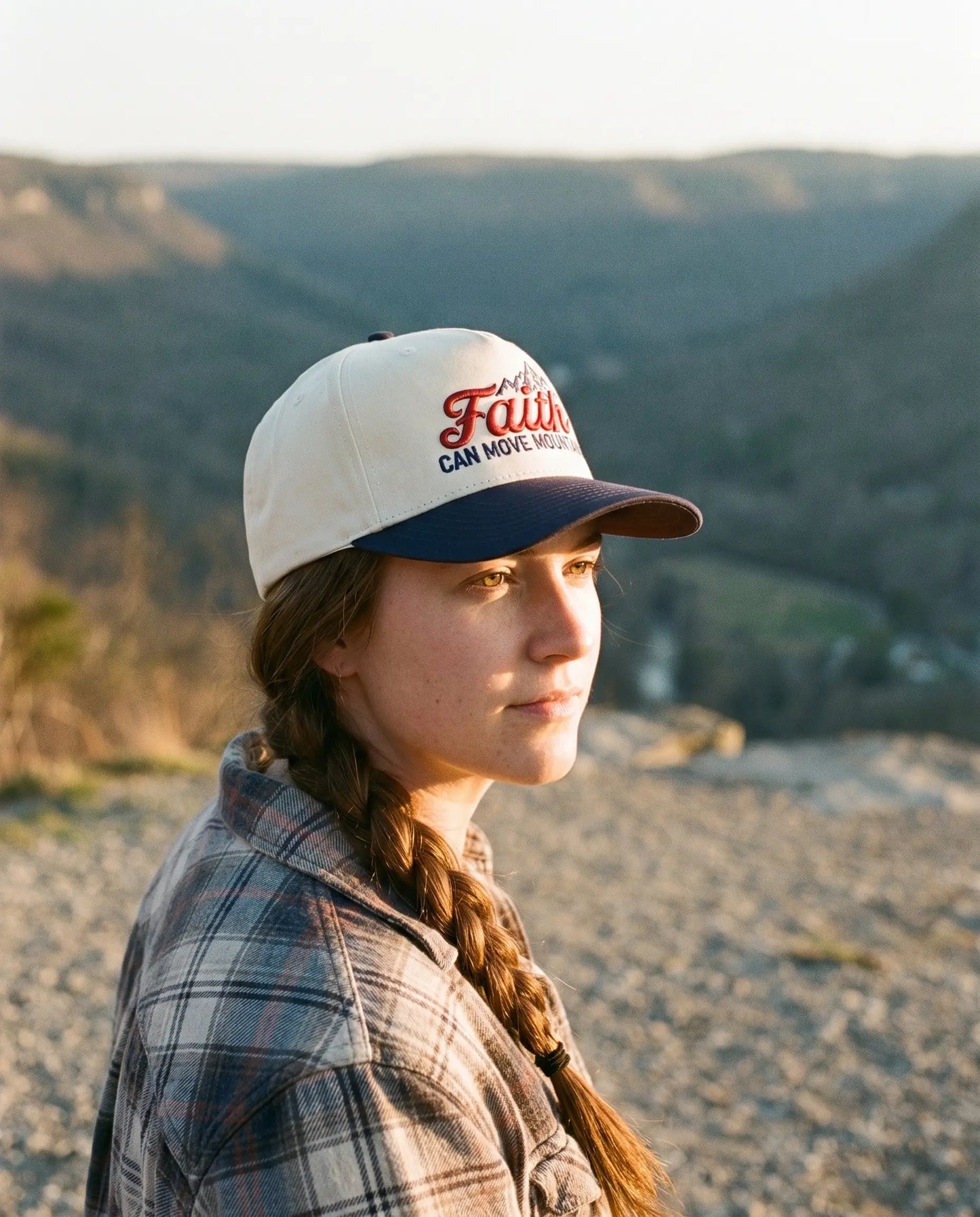 Model wearing the Faith Can Move Mountains Hat, Navy