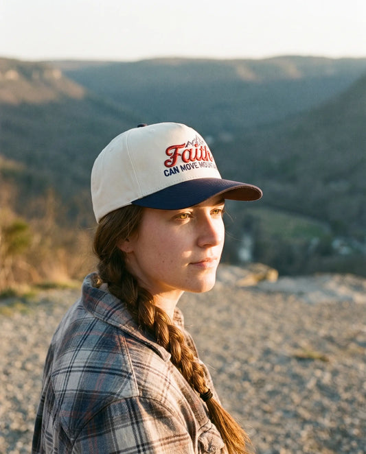 Model wearing the Faith Can Move Mountains Hat, Navy