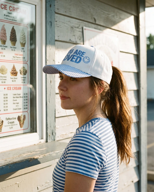 Model wearing the You Are Loved Hat, Blue Gingham