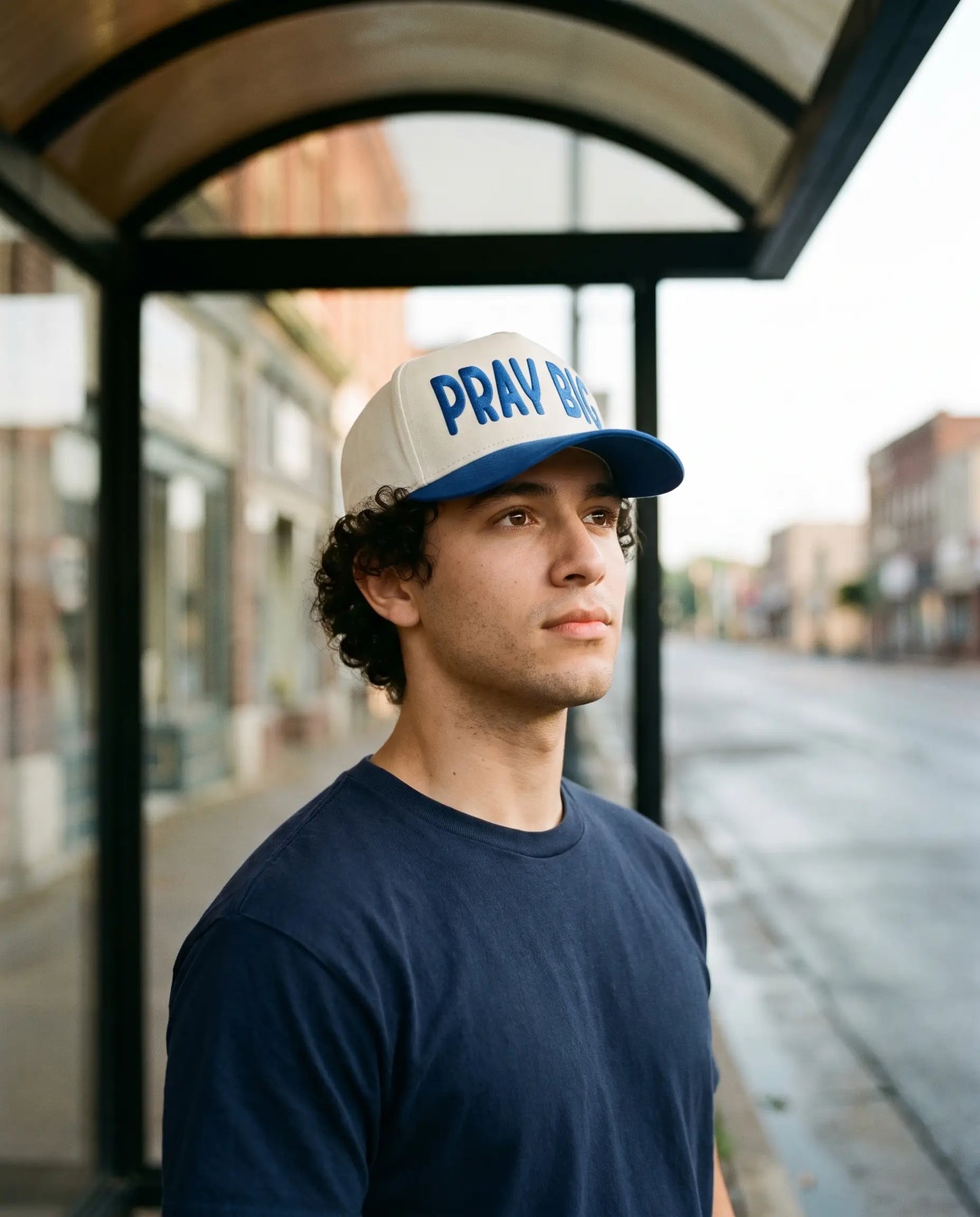 Model wearing the Pray Big Hat, Royal Blue