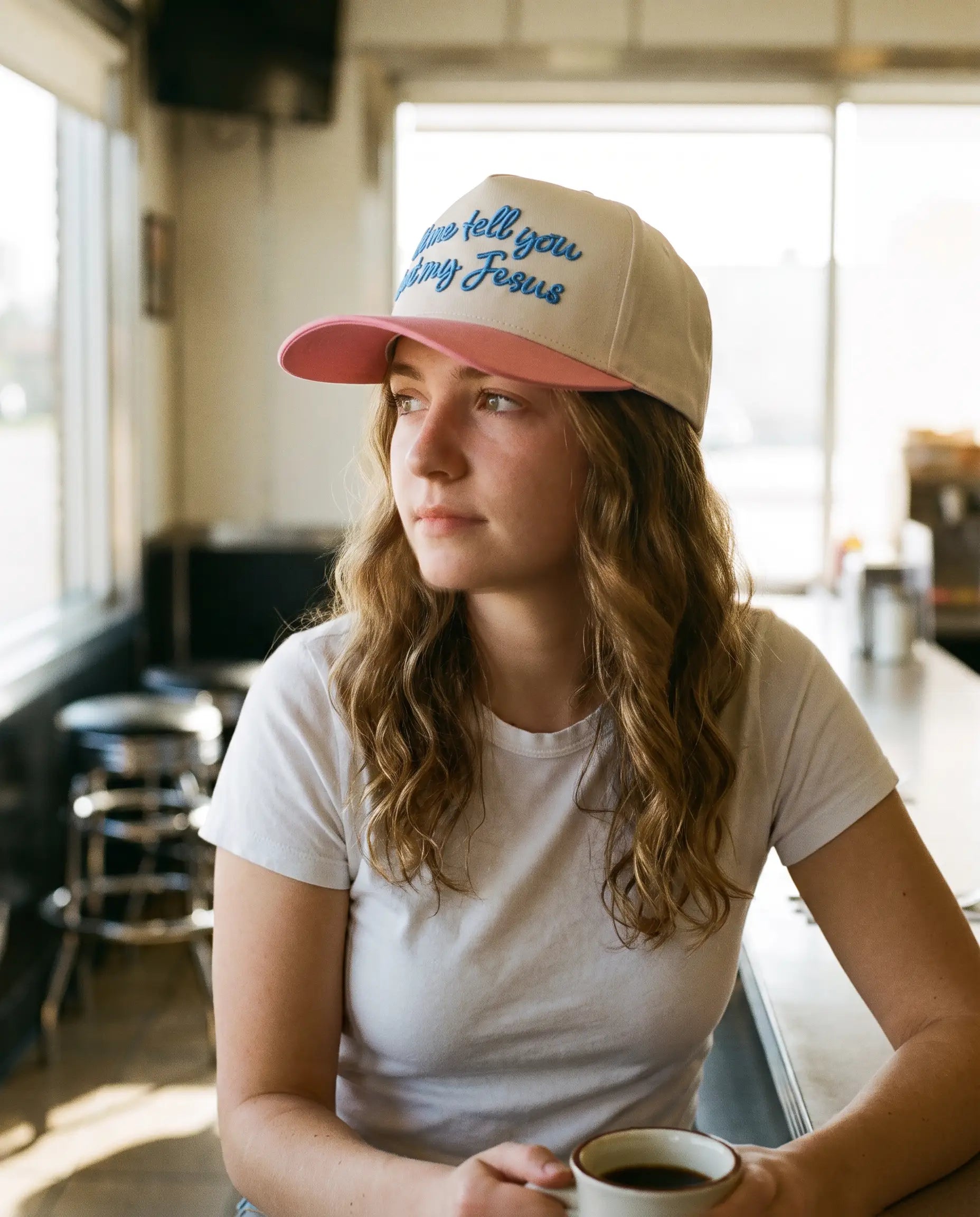 Model wearing the Let Me Tell You Bout My Jesus Hat, Pink