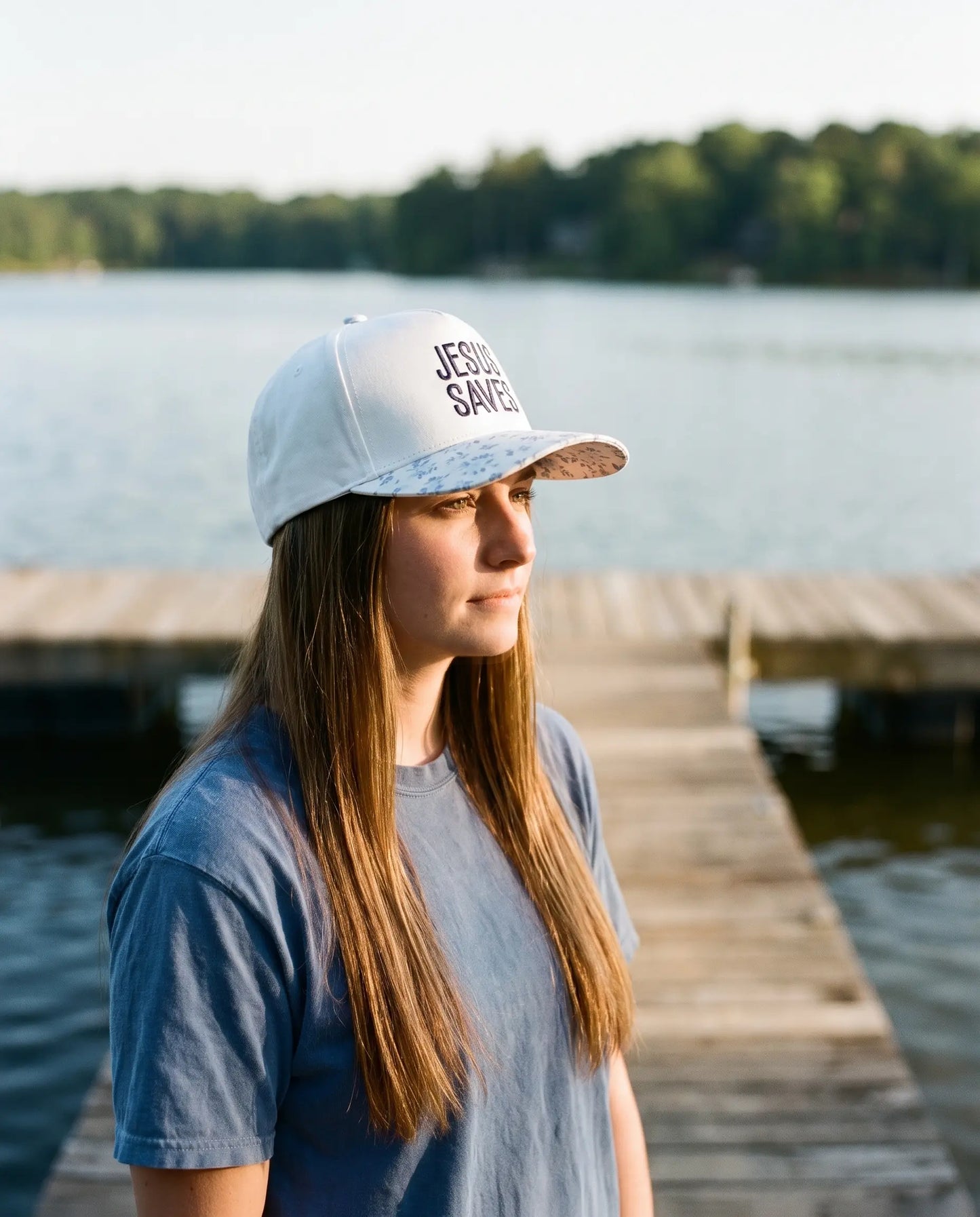 Model wearing the Jesus Saves Hat, Blue Floral