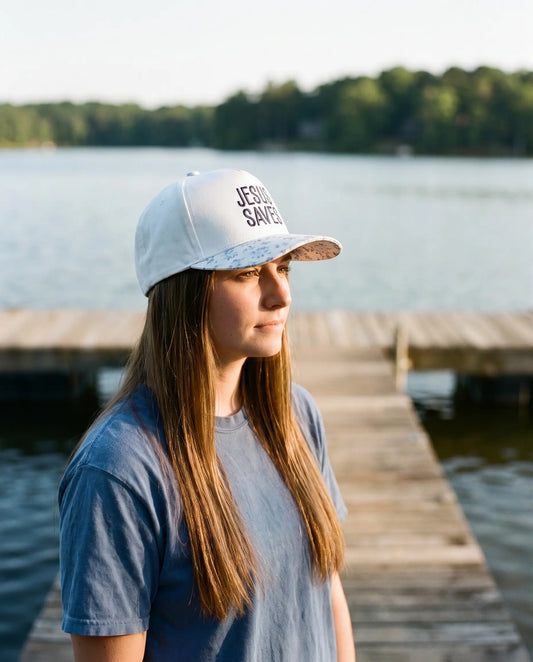 Model wearing the Jesus Saves Hat, Blue Floral